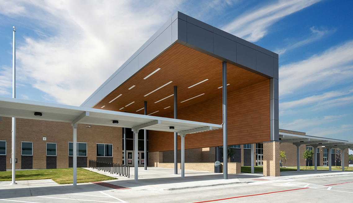 School entry canopy finished in dark aluminum composite material panel