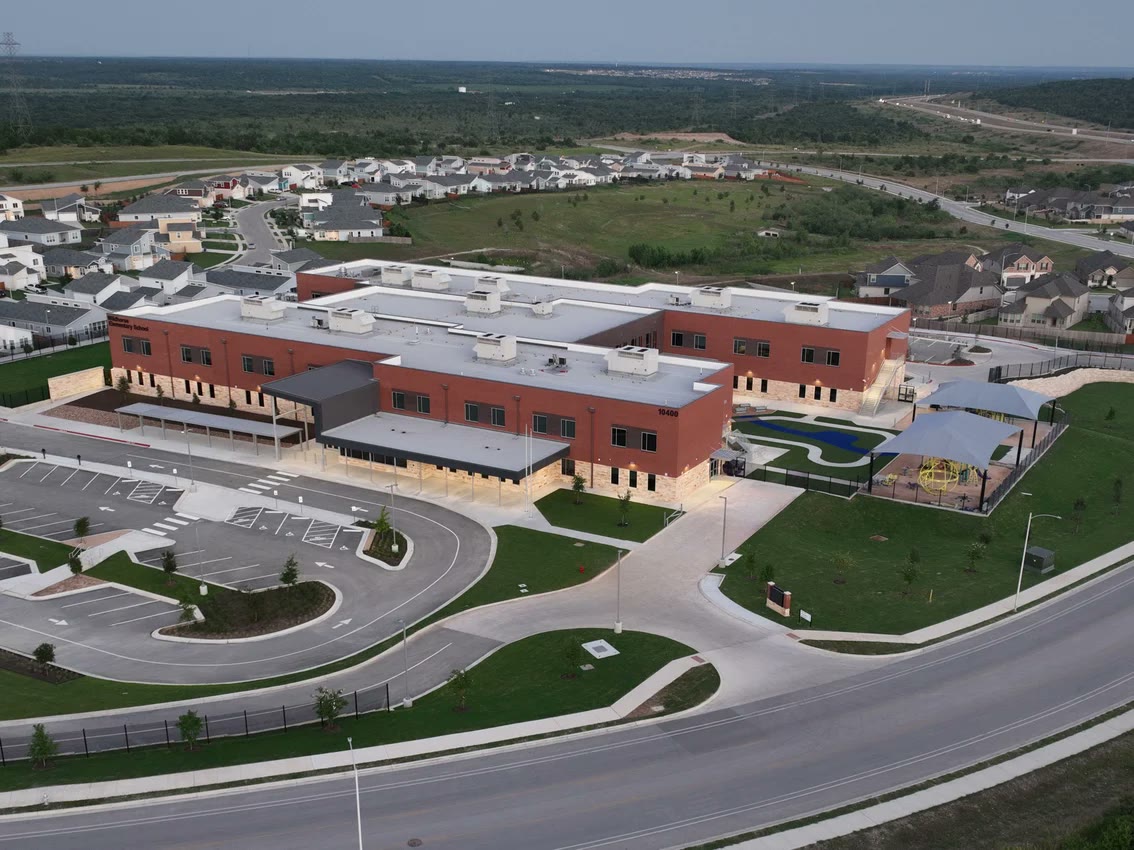 Aerial view of Manor Elementary School with a white low-slope membrane roof