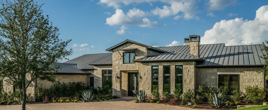 Clay tile roof over a porte-coch&egrave;re at a Hill Country estate